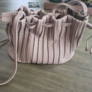 Pleated bucket  handbag. Shoulder strap